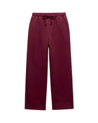 A pair of wide-leg sweatpants in a deep burgundy color, featuring an elastic waistband with a matching drawstring, shown against a plain white background.