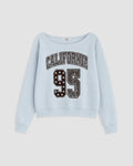 A light blue long-sleeve sweatshirt with 'CALIFORNIA 95' printed on the front in distressed varsity-style lettering, shown against a light gray background.